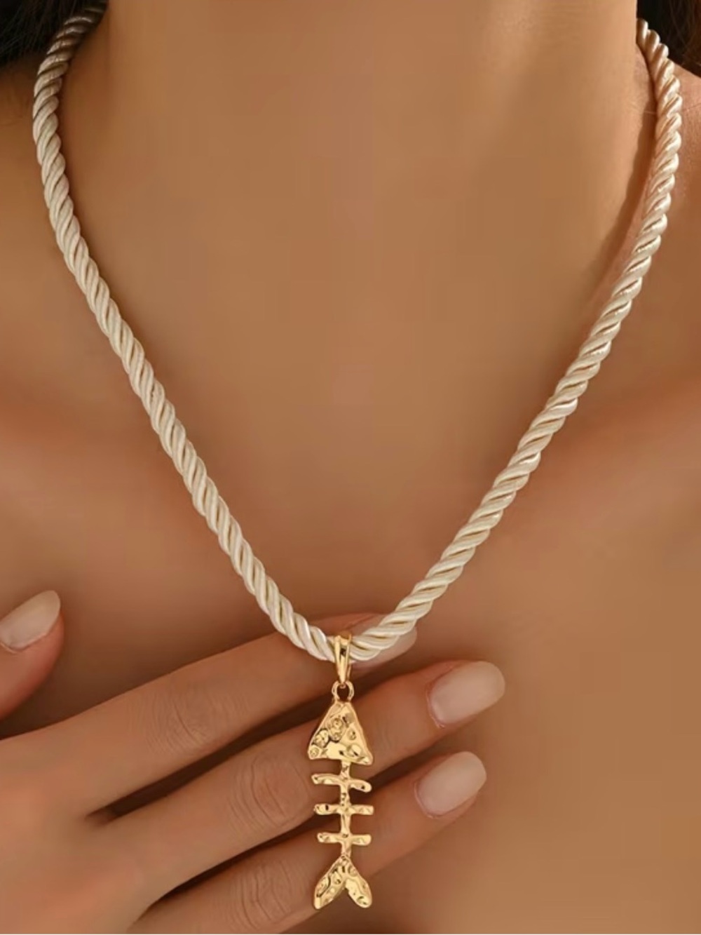 Gold Fishbone Pendant Necklace on Cream Rope Chain
